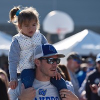 Dad with daughter on his shoulders